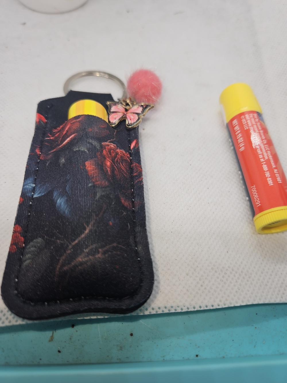 Floral Black Lip Balm Keychain Holder with Pink Pom Pom